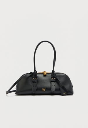 Black leather handbag with rounded shape, gold hardware, dual handles, and detachable shoulder strap. Features logo and zipper closure.