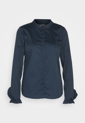 Navy blue long-sleeve blouse with a high collar, buttoned front, and ruffled cuffs. Made from smooth fabric with a structured design.