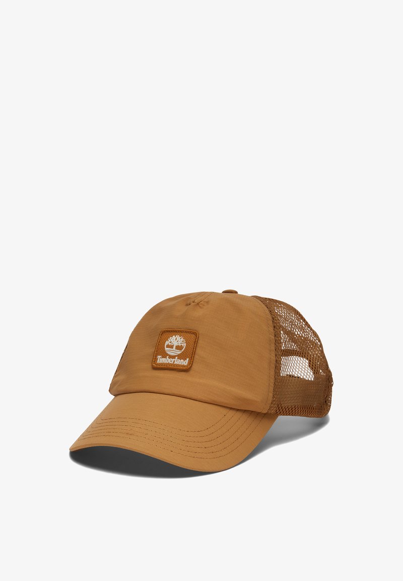 Brown mesh-back cap with a rounded crown, short visor, and Timberland logo patch. Smooth fabric with mesh panels for breathability.