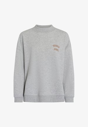 Gray sweatshirt with a high neck, loose fit, and long sleeves. Features a small brown embroidered logo on the upper left. Cotton blend material.