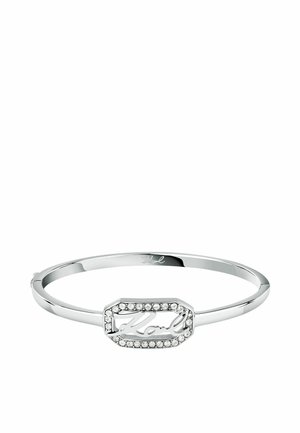 Braccialetto in argento con un centro ottagonale decorato da scritte intrecciate e circondato da strass trasparenti, finitura in metallo lucido.