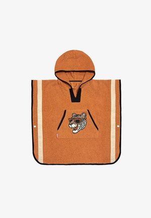 Ponczo z kapturem w kolorze rdzy z beżowymi paskami po bokach, czarną lamówką, przednią kieszenią i haftowanym tygrysem w okularach przeciwsłonecznych na kieszeni.