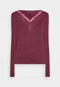 Burgunderfarbener Langarmtop mit geripptem Texture und Spitze am V-Ausschnitt. Hat eine figurbetonte Passform und einen leicht geschwungenen Saum am unteren Ende.
