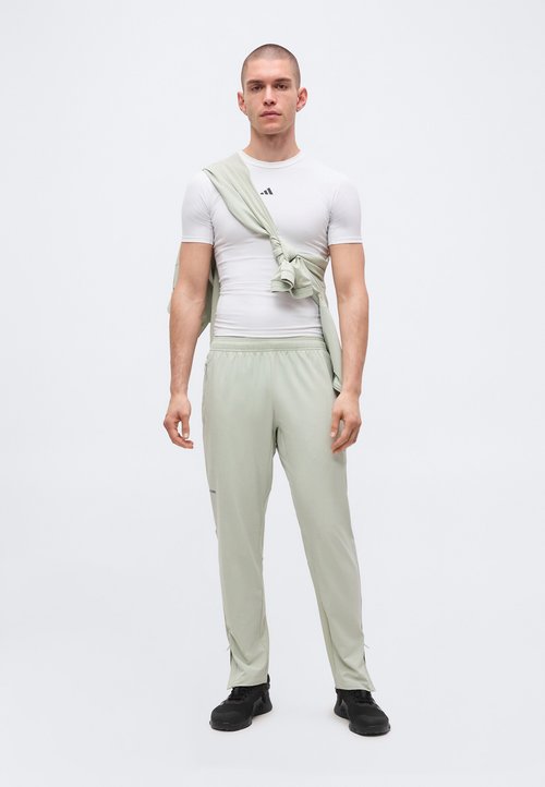 adidas TECH APPAREL SLIM - Tracksuit bottoms - halo green — photo 2