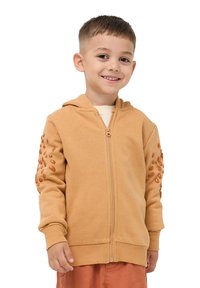 Felpa con zip color beige realizzata in cotone, con dettagli testurizzati sulle maniche e un cappuccio. Tessuto morbido con una vestibilità casual.