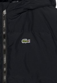 Lacoste BLOUSON WINTER ELEVATED ESSENTIAL UNISEX - Vinterkåpe / -frakk - black