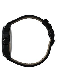 Montre analogique noire avec un boîtier octagonal texturé, un bracelet en silicone noir et une doublure intérieure beige. Elle possède trois boutons latéraux pour les réglages.