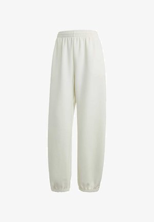 Fehér jogger nadrág, puha anyagból készült, rugalmas derékkal és szűkített szárakkal. Diszkrét logó részlet az oldalon.