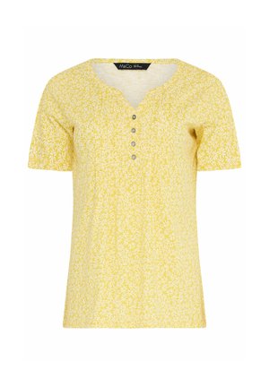 Geel topje met korte mouwen en witte madeliefjes, ronde hals met vier kleine knoopjes aan de voorkant.