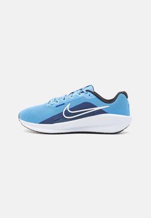 Light blue Nike running shoe with white sole, dark blue accents, and white swoosh logo, shown from the side on a white background.