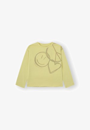 camiseta de manga larga de color amarillo claro en algodón suave, con un diseño gráfico que presenta una cara sonriente, un corazón y un símbolo de paz en color contrastante.