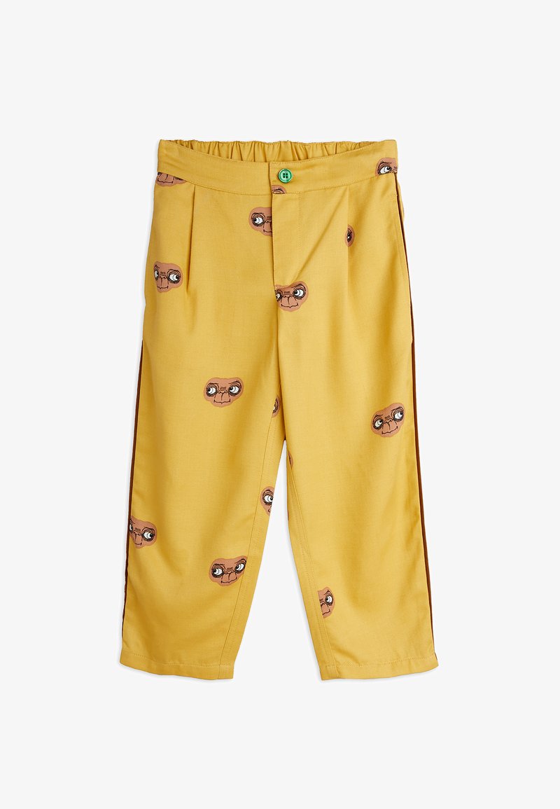 Κίτρινο παντελόνι με ελαστική μέση, διακοσμημένο με εκτυπώσεις προσώπων καρτούν εξωγήινων. Κατασκευασμένο από ελαφρύ ύφασμα με ίσια γραμμή.