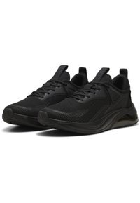 Zwarte sportieve schoenen met een bovenwerk van mesh, gladde synthetische overlays, gestructureerde zolen en een gevoerde middenzool met een zichtbare luchtunit.