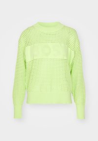 Pullover lavorato a maglia di un brillante verde neon, con un design a rete e una fascia solida, tessuto testurizzato e maniche lunghe.