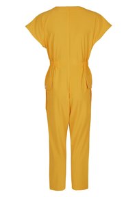 Gul jumpsuit med en avslappnad passform, korta ärmar, elastisk midja och två sidofickor. Slät tyg, ankel-lång med en enkel design.