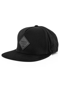 Black cap with a flat brim and a textured diamond patch featuring the brand name. Smooth fabric with subtle stitching details.