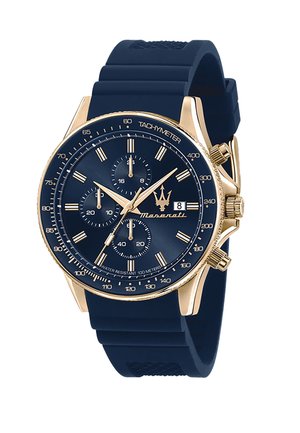 Orologio con cinturino in silicone blu e cassa in acciaio inox tono oro, quadrante blu scuro, tachimetro e sub-quadranti del cronografo. Presenta una finestra per la data.