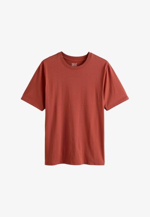 T-shirt z okrągłym dekoltem w kolorze rdzawego czerwieni, z krótkim rękawem, w regularnym fasonie, wykonany z miękkiej bawełny, charakteryzujący się prostą, gładką teksturą.