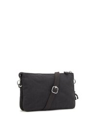 Borsa a tracolla nera in tessuto con finitura texturizzata, chiusura con zip, tracolla marrone e dettagli in metallo argentato. Forma rettangolare con particolari laterali.