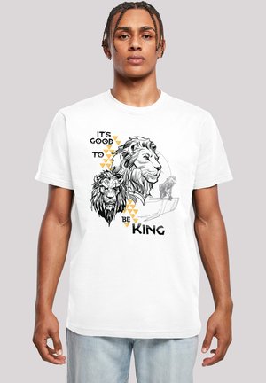 White cotton t-shirt featuring black and gold lion graphics, text "IT'S GOOD TO BE KING," and geometric accents. Short sleeves and crew neckline.
