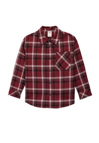 Punainen ja musta ruudullinen pitkähihais shirtti, joka on valmistettu pehmeästä kankaasta, napituksella ja vasemmalla puolella tasku.