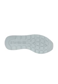 Suela de goma blanca con patrones de agarre texturizados y logo; presenta una serie de formas cuadradas y rectangulares elevadas para tracción.
