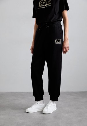 TROUSER - Pantalon de survêtement - black/gold-coloured