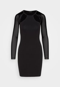 Robe noire cintrée longueur genou avec manches longues transparentes et détail découpé transparent près des épaules, encolure ronde.