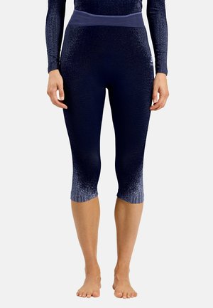 Marineblaue Sportleggings aus strukturiertem Stoff mit einem breiten Bund, präsentiert ein Farbverlaufdesign, das an dem Saum in ein heller Blau übergeht.