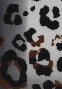 Leopard print fabric featuring large, irregular black and brown spots on a light grey background. Texture appears soft and fuzzy.