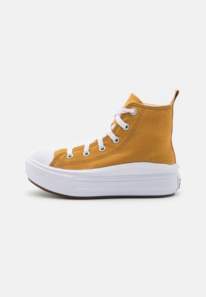 High-top sneaker in mustard yellow canvas with white rubber toe cap and sole. Features white laces and a rear pull tab for ease of wear.