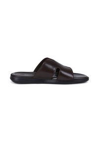 Dark brown leather slide sandal with wide strap featuring cut-out detail and black sole, viewed from the side on white background.