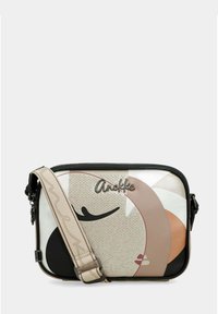 Prostokątna torba na ramię z abstrakcyjnym wzorem twarzy, beżowy regulowany pasek oraz logo "Anekke" z przodu.