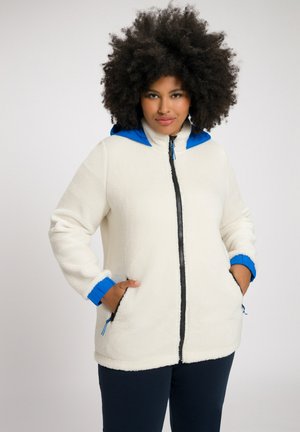 Weißer Fleece-Jacke mit blauer Kapuze und blauen Bündchen, ausgestattet mit einem schwarzen Reißverschluss und Seitentaschen. Weicher Stoff und lockere Passform.