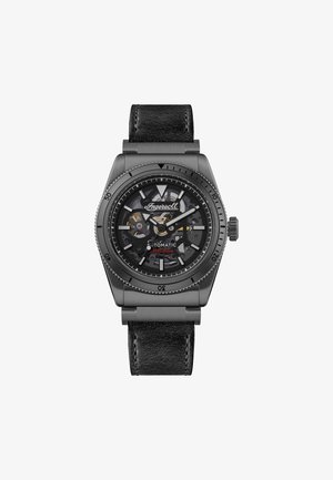 Automatic wristwatch with a black leather strap. Hexagonal metal case in matte gray, transparent dial showcasing intricate gears and markings.