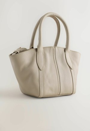 Light beige leather tote bag with textured surface, dual handles, and stitched accents. Round base with vertical seam details.