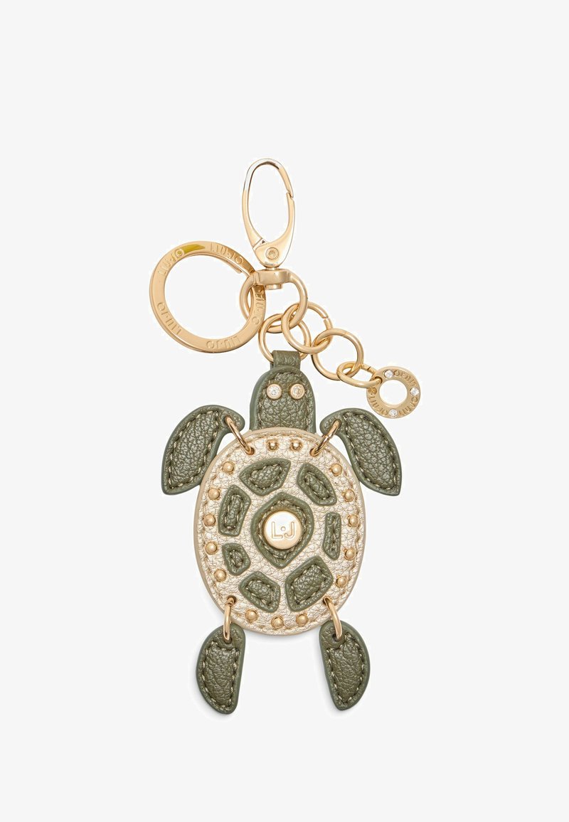 Portachiavi a forma di tartaruga, realizzato in pelle testurizzata verde e beige, con accessori in oro e borchie decorative.