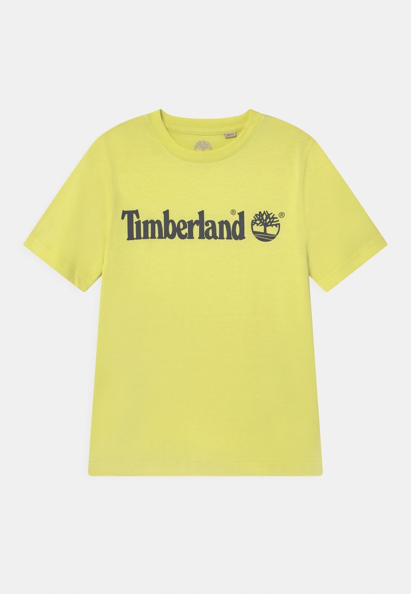 T-shirt jaune à manches courtes avec col rond, texte noir "Timberland" et logo arbre centrés sur la poitrine.