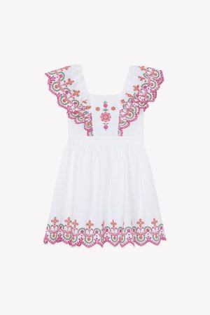 Valge kleit lilleliste tikanditega roosas, oranžis ja rohelises. Omadused on volangidega varrukad ja sätendav serv. Kerge kangas, vormis ülaosa.