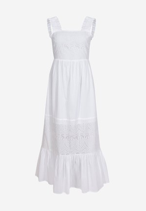 Vestido maxi de algodón blanco con escote cuadrado. Presenta tirantes con volantes, bordados de ojales con patrones de palmera y un dobladillo con volantes en capas.