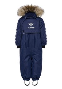 Marinblå snödräkt med huva fodrad med fuskpäls, elastiska manschetter och logotyp. Har dragkedja och justerbara stövelremmar för en säker passform.