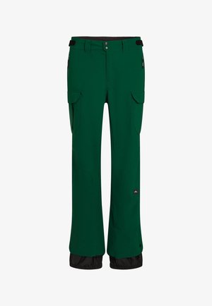 Žalios nepralaidžios kelnės su tiesiu sijonu, elastinga juosmens juosta, šoniniais kišeniais su užtrauktuku ir juodu apatine dalimi.