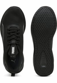 Black athletic shoes with a breathable mesh upper, flat laces, textured rubber sole, and Puma logo on the tongue and side.