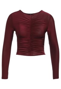 Burgundské dlouhé rukávy crop top vyrobený z elastické látky, s nabíranými detaily v přední části a kulatým výstřihem. Celkově hladká textura.