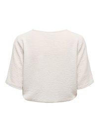 Chemise blanche à manches courtes avec un motif froissé texturé vue de dos.