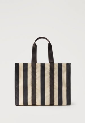 Sac fourre-tout rayé vertical noir et beige avec deux poignées noires, forme rectangulaire, debout sur fond blanc.