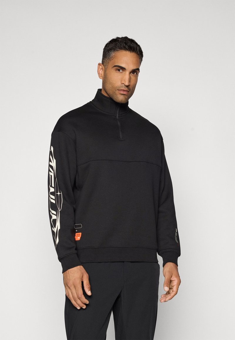Black zip-up sweatshirt with a high collar, featuring white graphic designs on the sleeves and an orange logo detail near the hem.