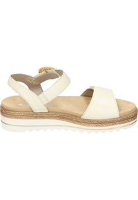 Creme-kleurige sandaal met brede kruislussen en een geweven accent op de hak. Getextureerde rubberen zool met een iets verhoogd plateau.