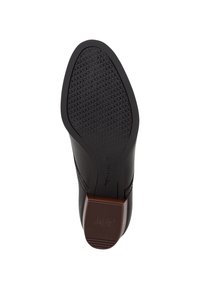 Suola di scarpa in pelle nera con un motivo di presa testurizzato, con un accento marrone sul tacco. Taglia contrassegnata come 37.