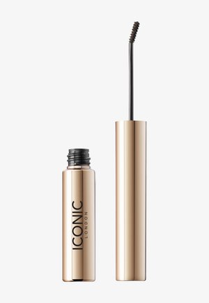 Złoty cylindryczny pojemnik na tusz do rzęs z czarną szczoteczką. Szczoteczka ma zakrzywioną główkę, a nazwa marki "ICONIC LONDON" jest drukowana na czarno.
